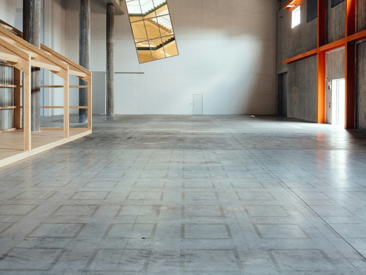 Warehouse with bare, stained concrete floor